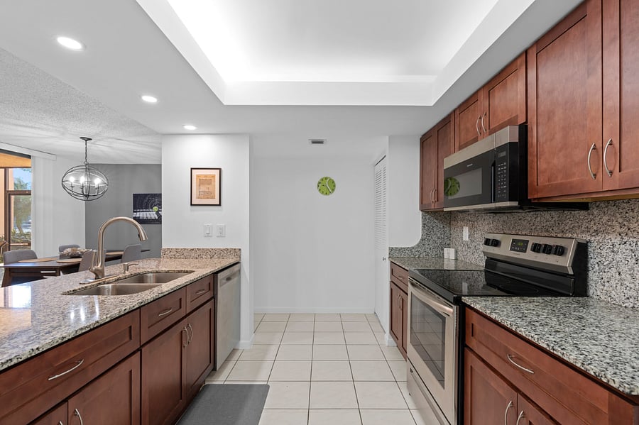 Kitchen, granite countertops, real wood, cabinetry, and new appliances