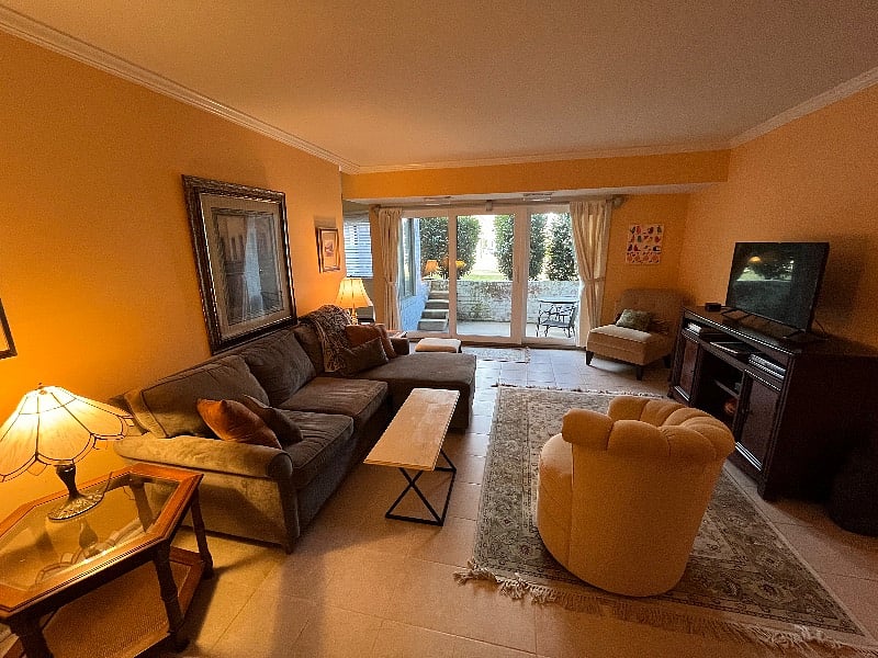 Living area with full cable TV, wifi, walk out porch. Watch the sunset outside your living room windows.
