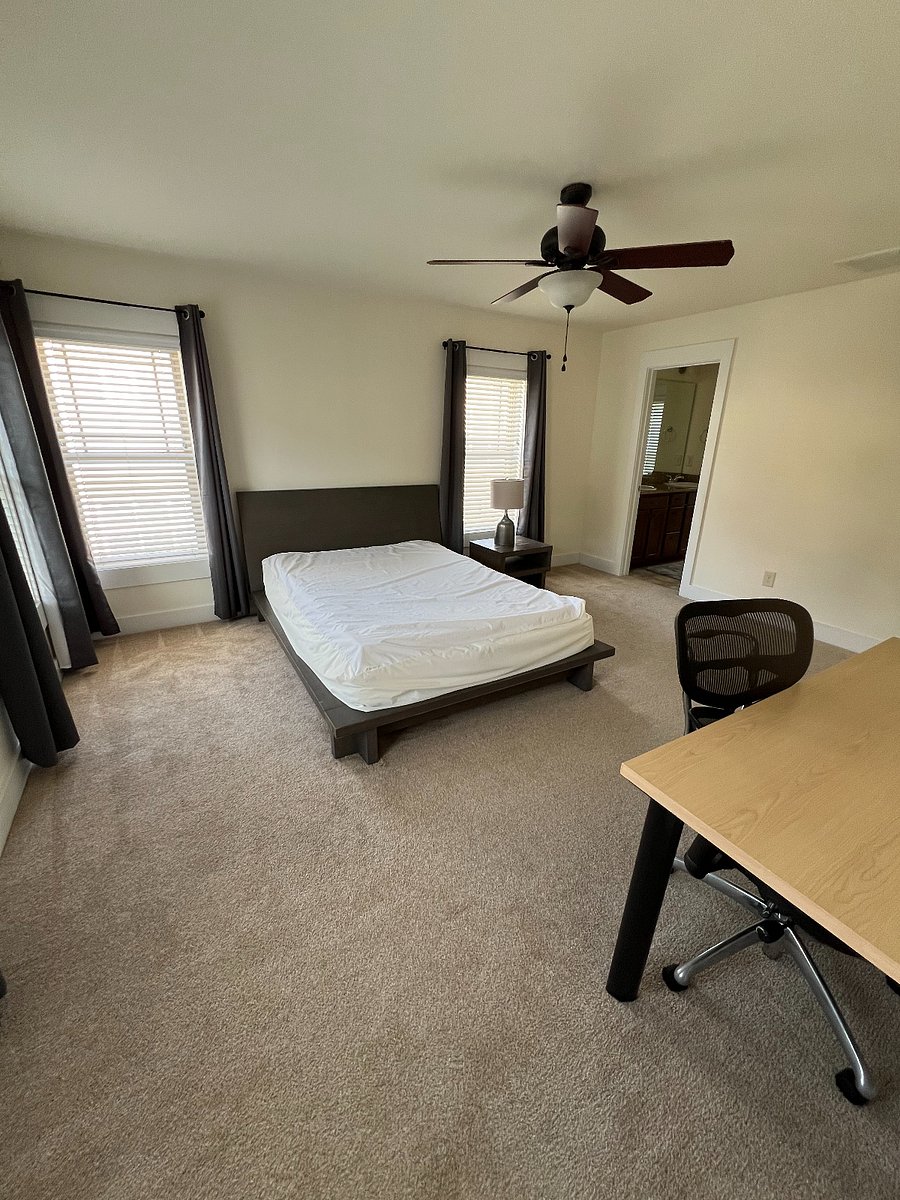 Third floor queen bed with bed bug mattress cover. Privacy blinds and blackout curtains