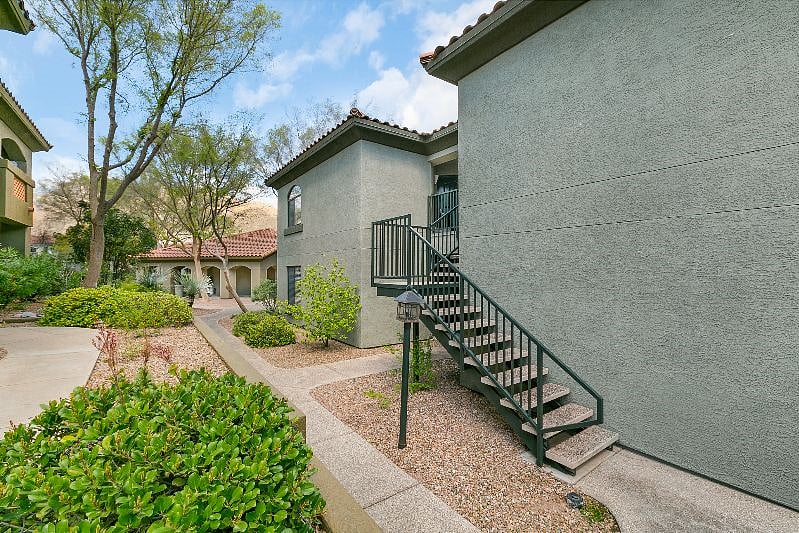 Second floor unit steps from one of the pools and gym.