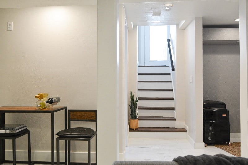 Plenty of sunlight! Stairs to outside flood the room with light. There is another large window in bedroom.
