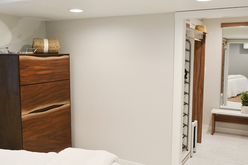 Large walk-in custom made closet connected to bedroom.