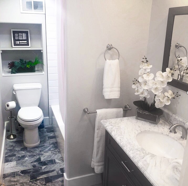 New tile with rugs. Stairs have hardwood flooring.