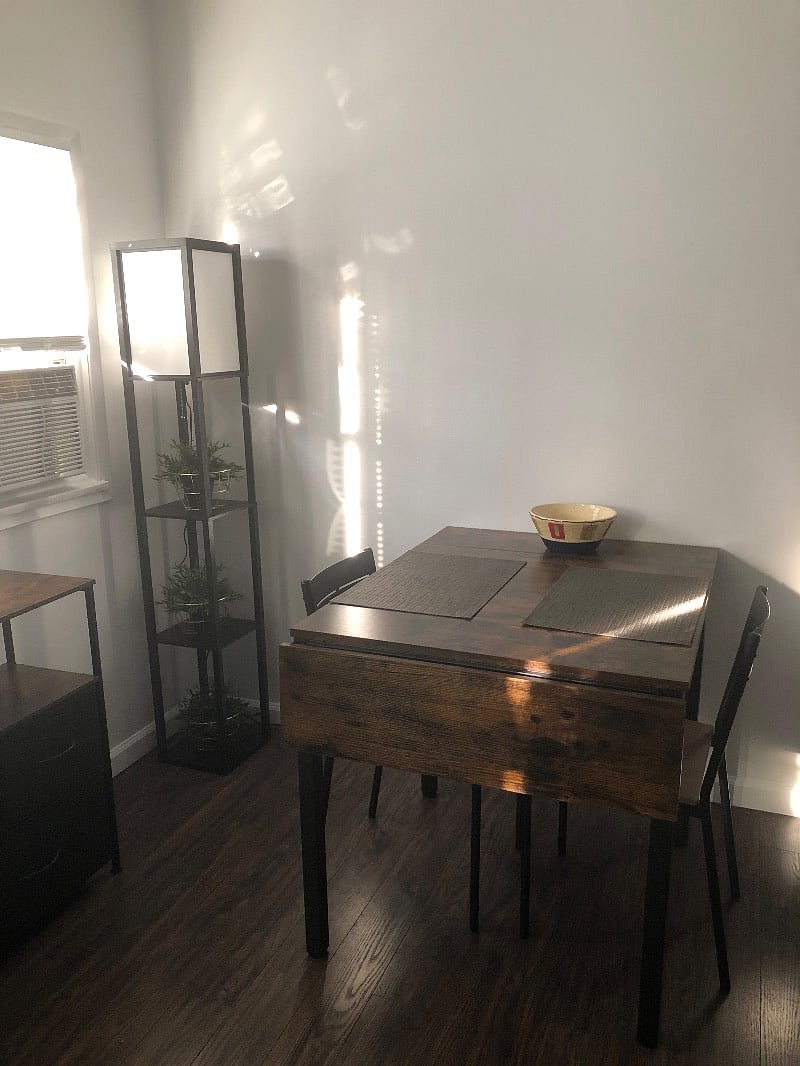 Dining area/ work station with foldable leaves for table expansion.
