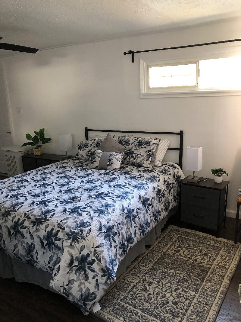 Queen size bed with night stands, touch lamps with outlet and charging link.