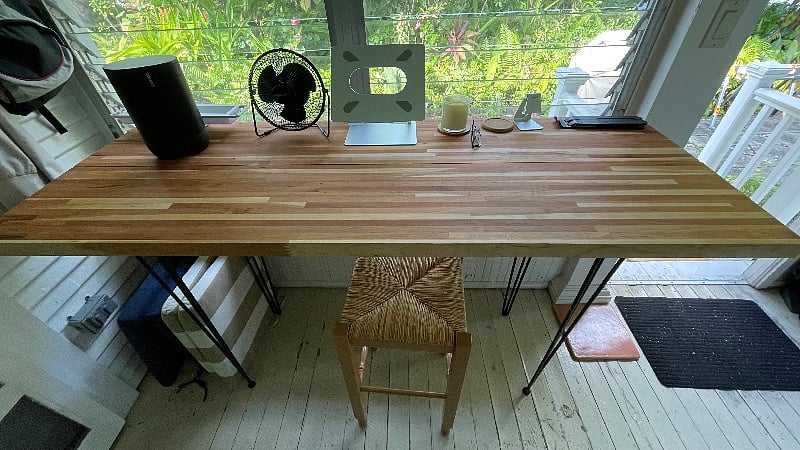 screened in porch cherry table sitting/working area