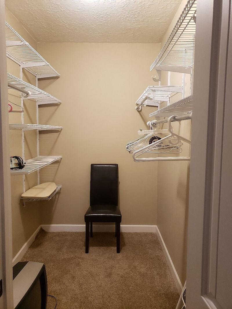 Walk in closet in master bedroom.  Generous closets and storage space.