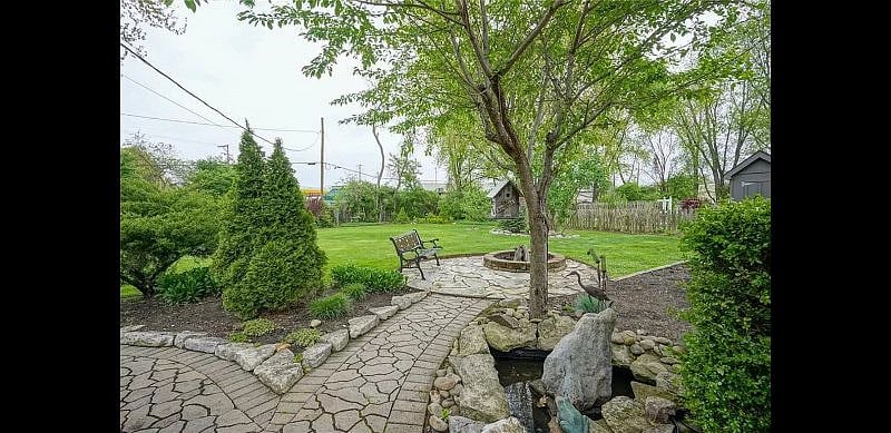 pass the garden, fire pit and pond to enter Studio