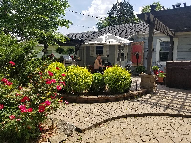 View of the patio from the lower patio - and my son waving!