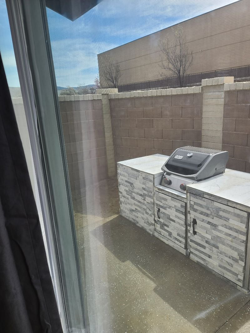 Looking out sliding glass door to grill