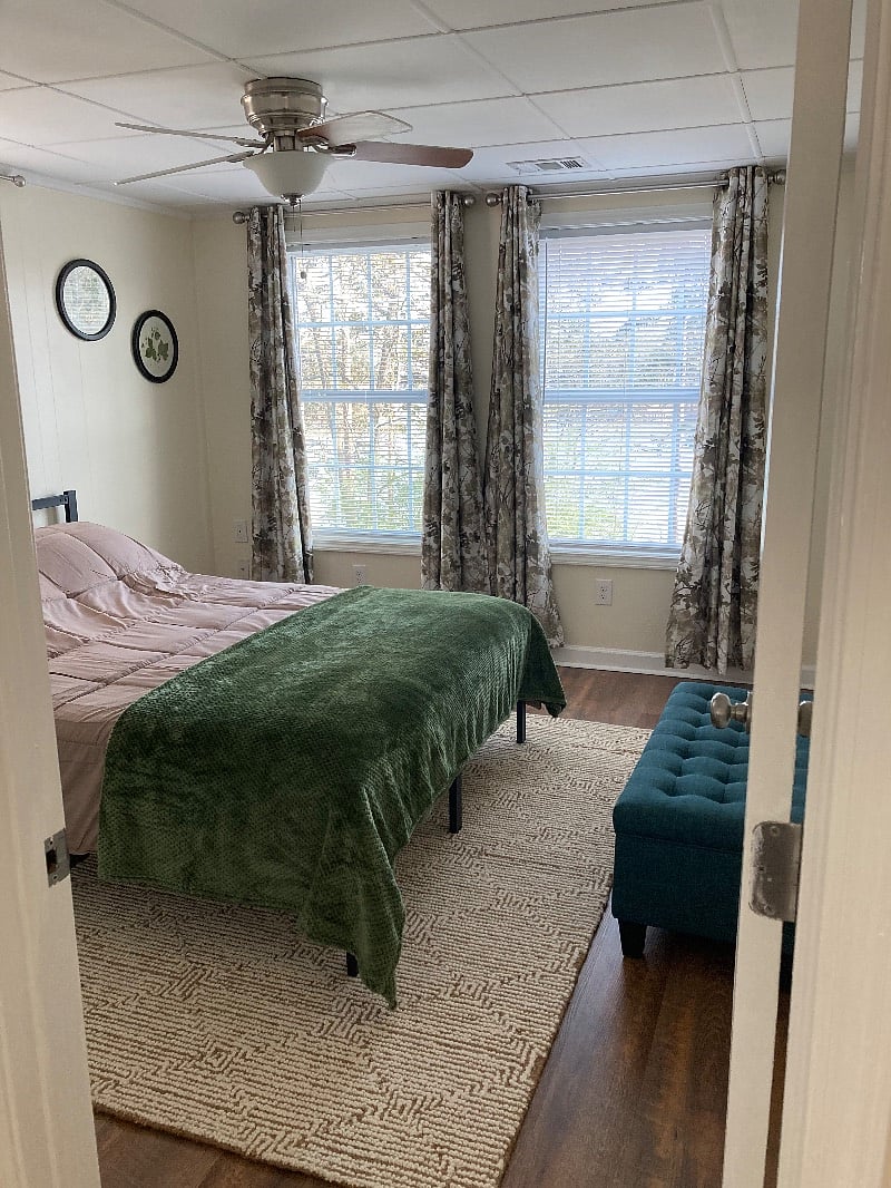 First Bedroom: Queen-sized Bed with Stunning Lake Views