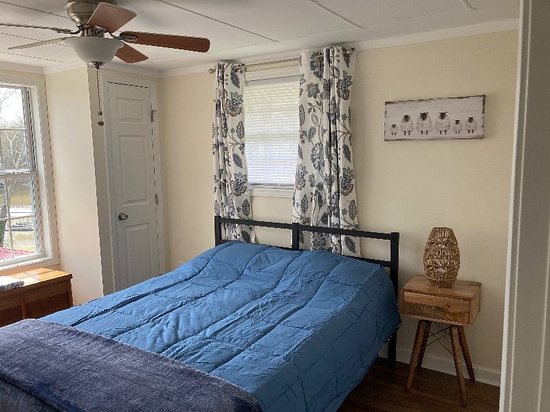 Second Bedroom with Queen-sized bed and lake view.