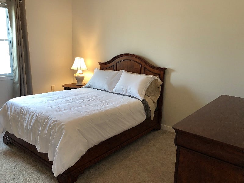 Cozy full size bed with memory foam mattress.
