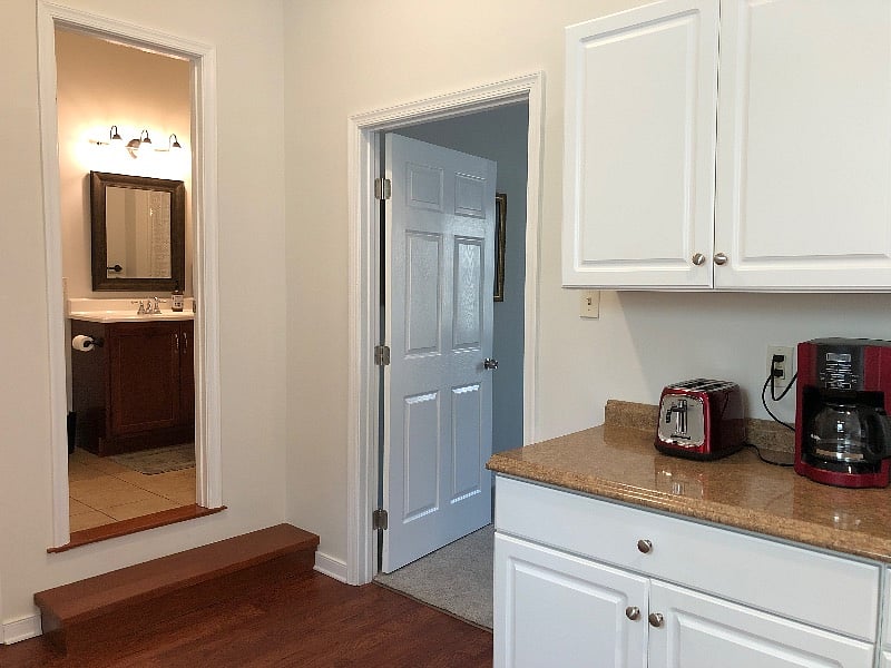 Bedroom is located off the kitchen area.