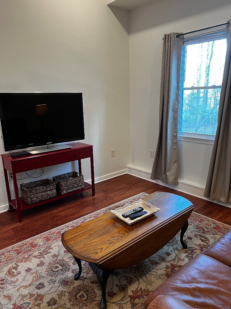 Under the TV stand are baskets filled with brochures of places to visit during your stay.