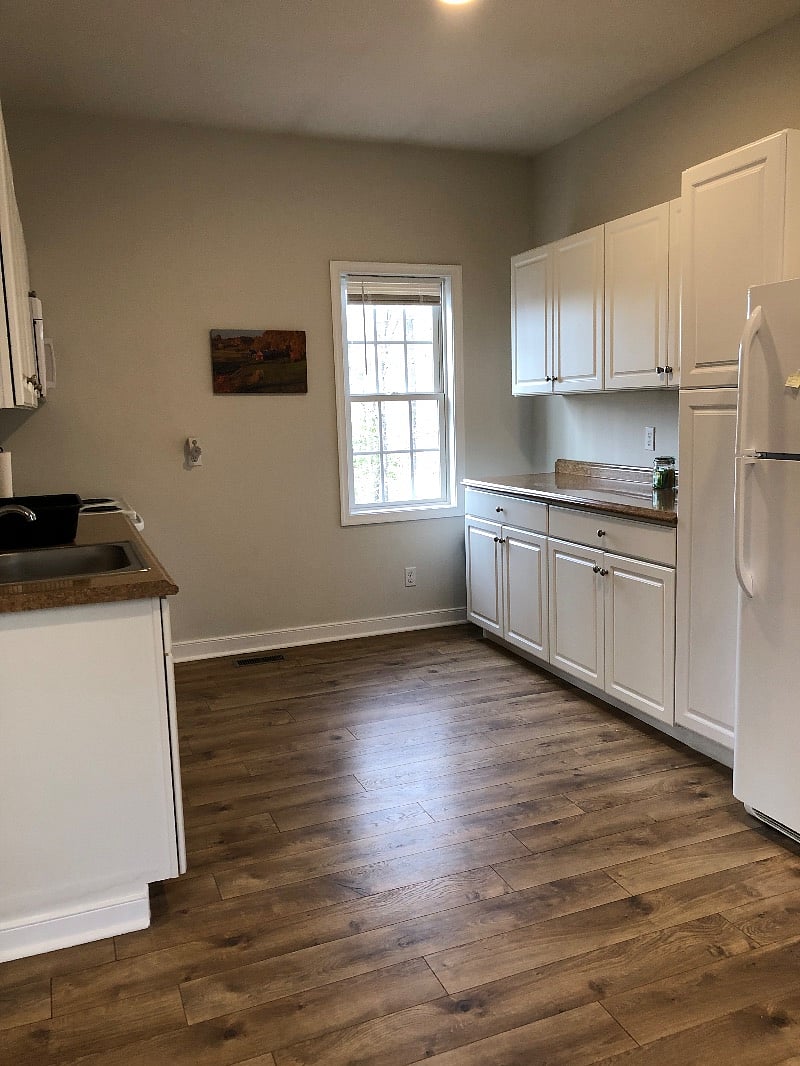 Large kitchen area with stove, dishwasher, full size refrigerator, microwave, toaster and coffee pot. There is plenty of counter space and a pantry closet.