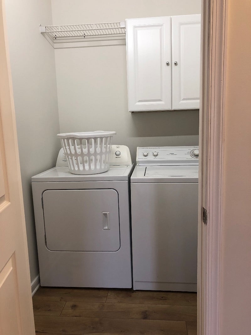 Full capacity washer and dryer with storage cabinets