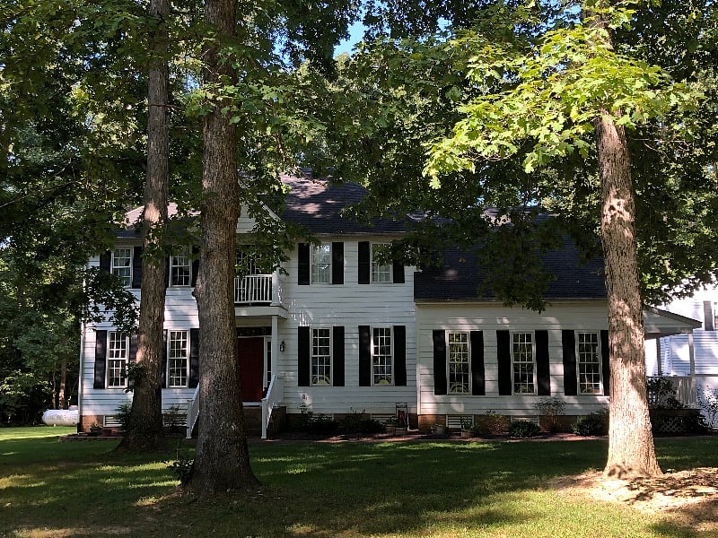 Main residence on 6+ quiet acres. Apartments are in detached building.