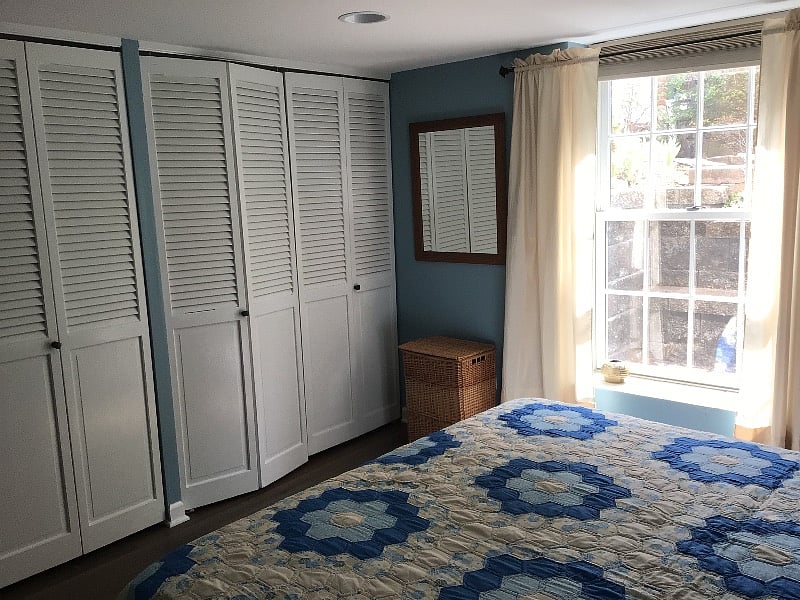 Another view of the bedroom showing closets