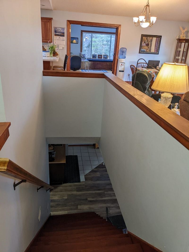 Front shared entryway, staircase to lower level (your unit)