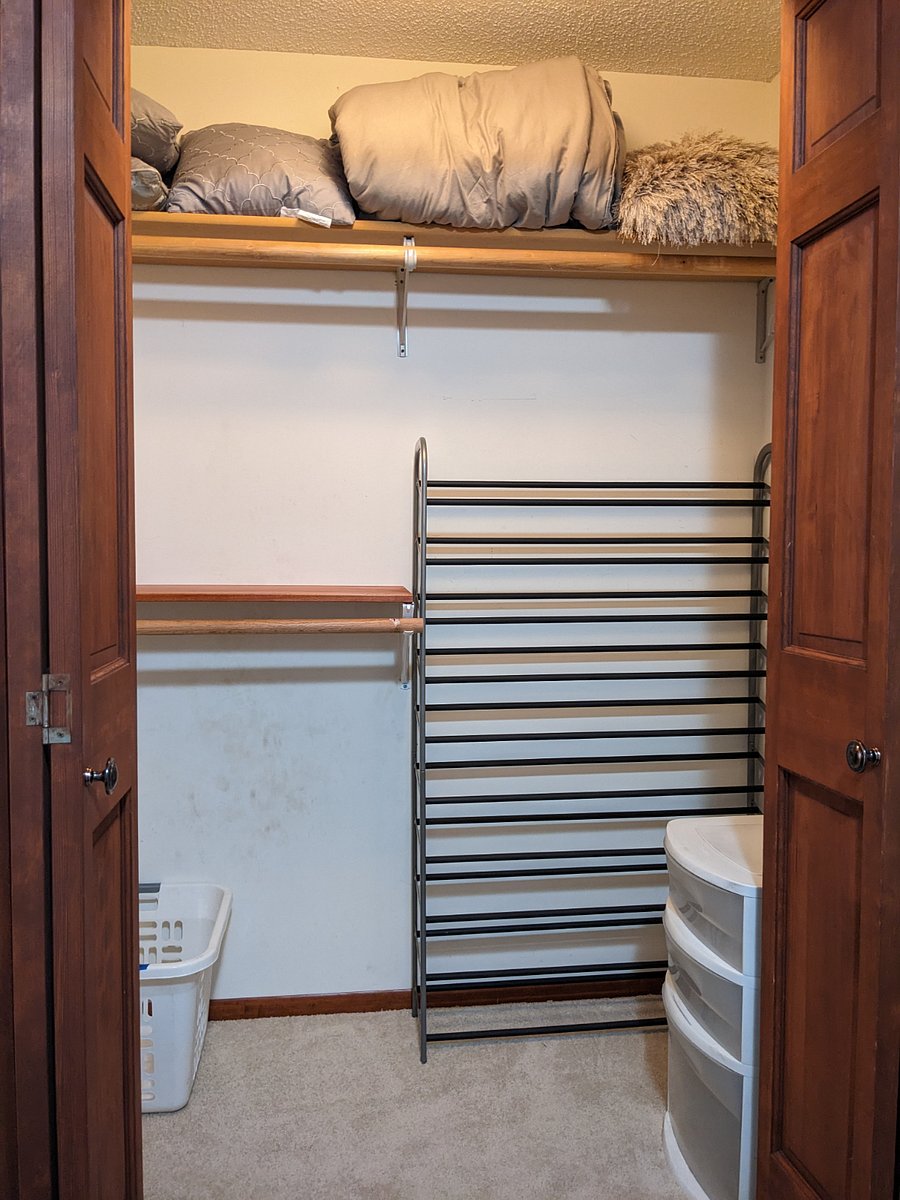 Second bedroom closet. There are hangers, baskets, and shelving options for your use.