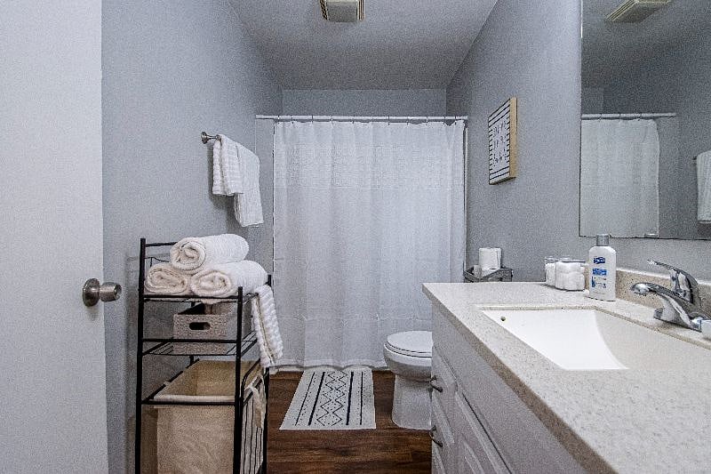 Fully stocked bathroom with soft towels and soaps.