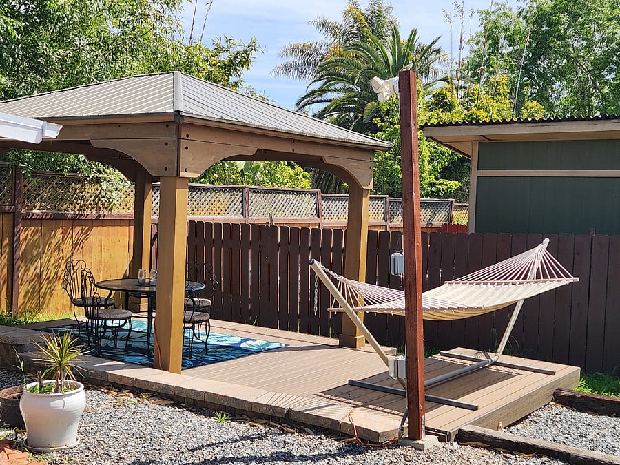 hammock, pergola, deck and yard.
