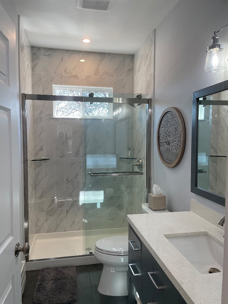 large shower with full glass sliding doors