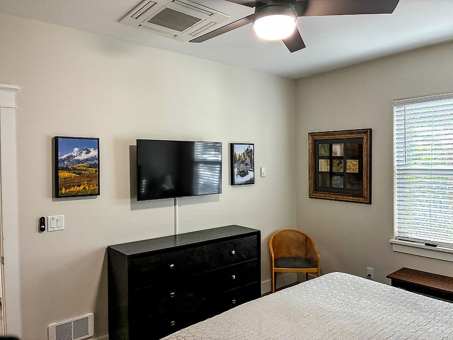 bedroom TV above a large dresser
