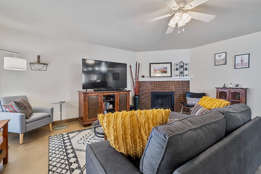 Our spacious living room offers plenty of seating for everyone to enjoy a movie night or unwind by the cozy fireplace.