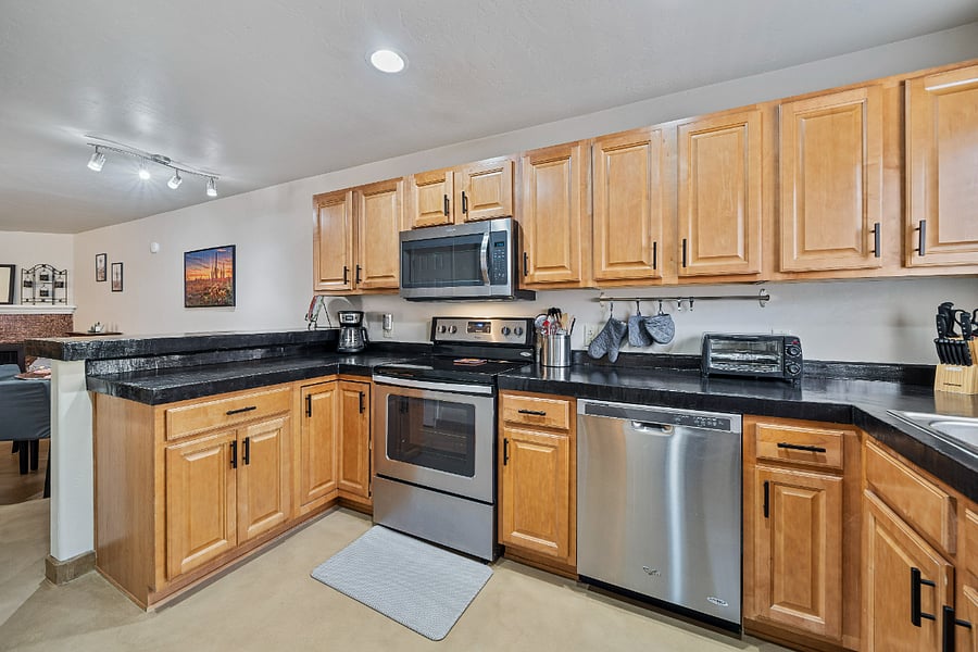 Take pleasure in preparing your favorite meals in our roomy kitchen, designed with ample counter space for all your cooking needs and plenty of storage to keep everything organized and within reach.