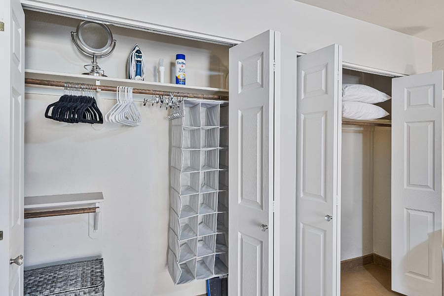 The primary bedroom features two spacious closets, each well-equipped with plenty of hangers and ample storage space to keep your belongings organized during your stay.