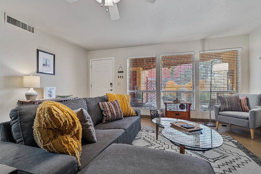 Relax in the living room while enjoying an abundance of natural light streaming in from the courtyard.