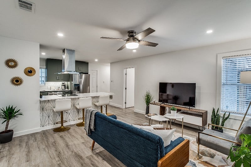 A view from the entrance door, looking into the living room and kitchen peninsula