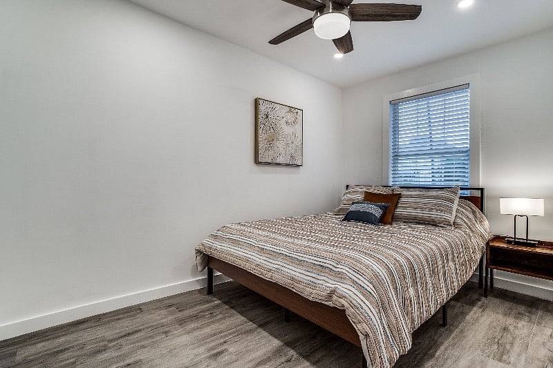 Cozy bedroom #2 with a queen size bed, and luggage rack