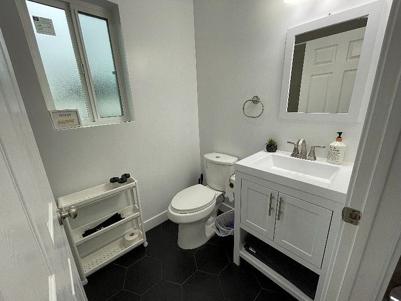 Brand new bathroom with ample storage to keep toiletries and towels.