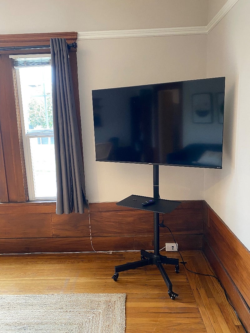 Smart TV on rolling cart to watch from where you want.