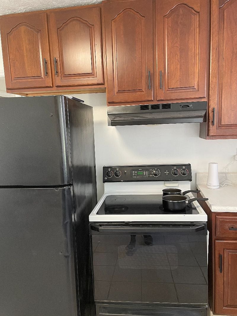 Fully Stocked kitchen including, toaster, microwave, dishwasher, fridge and stove.