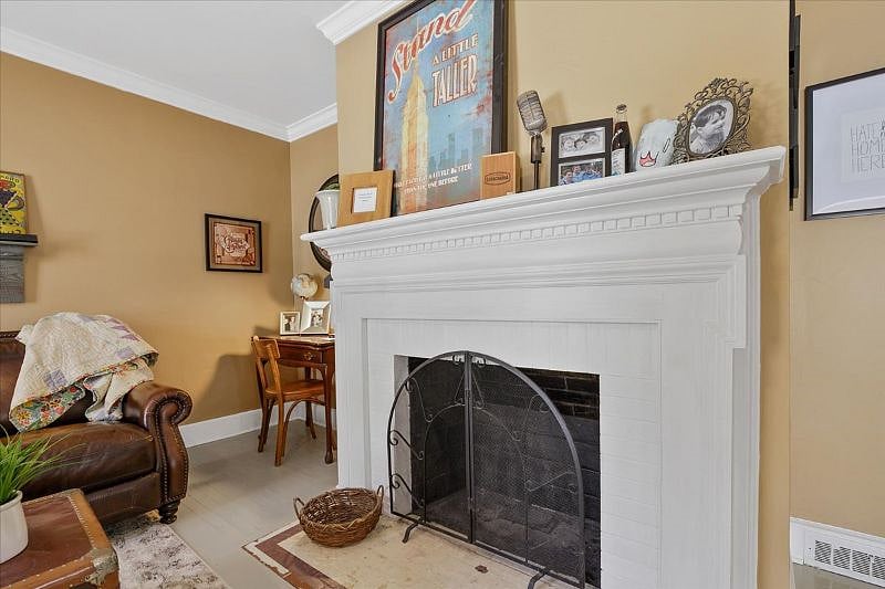 Living room at Hunsuckers Place featuring comfortable seating, natural light, and a calm space for extended stays, remote work, and travel nurse housing in Greensboro NC.