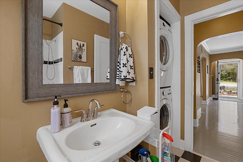 Bathroom with tub and shower and modern updates, providing a clean and functional space for extended stays near Cone Hospital in Greensboro NC.