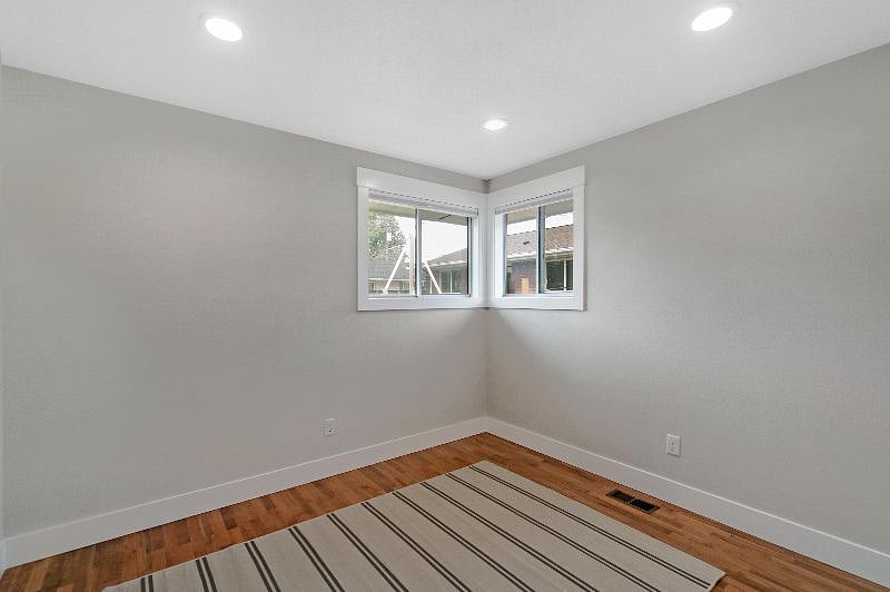Bedroom 3. This room has a full size bed and a desk (not pictured). Use as a guest room, an office, or extra storage.