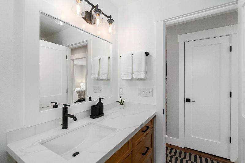One bathroom with excellent lighting and heated floor!
