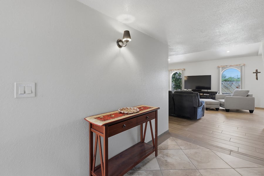 There is a 3" stepdown between the entryway and the living room.