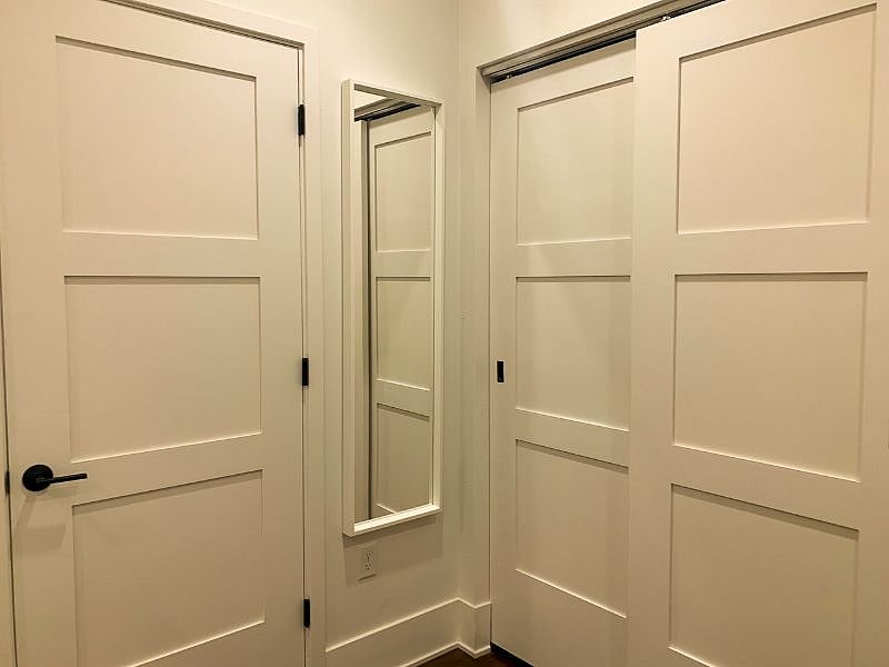 Mirror next to closet