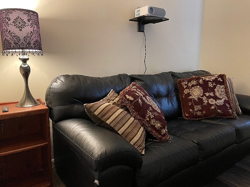 We converted the fourth bedroom into a living area with a projector. There is a pull out couch, so this can serve as a fourth bedroom option, a private enclosed office, or a family area.