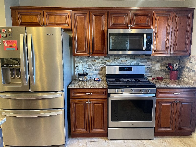 Theres a full kitchen with spacious cabinetry, including lots of countertop space and appliances.
