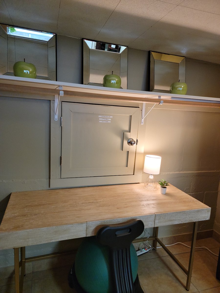 Desk with Light and Entrance to Storage Area