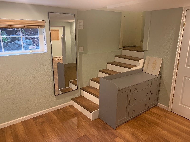 Foyer entrance area with 2 closet spaces with updated wood laminate flooring.