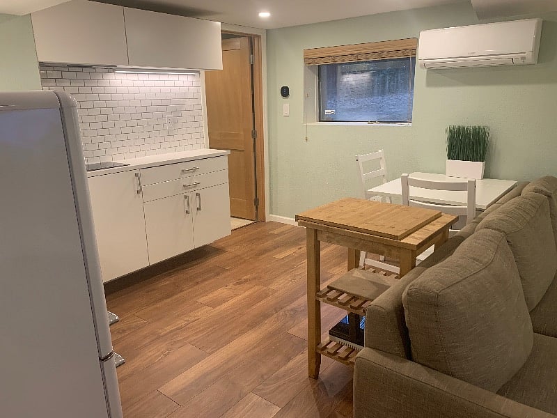 Eat-in kitchenette with new retro fridge + freezer, induction 2-burner stovetop, garbage disposal, and more.