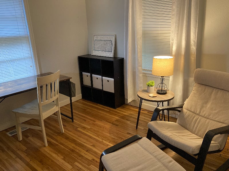 Office room with rocking Ikea Poang chair and ottoman. This room can also be converted into a second bedroom.